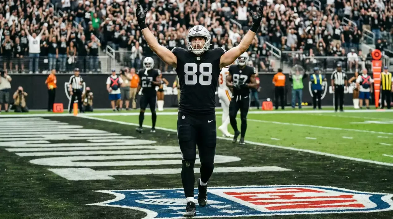 NFL player celebrating after scoring the opening touchdown of a game