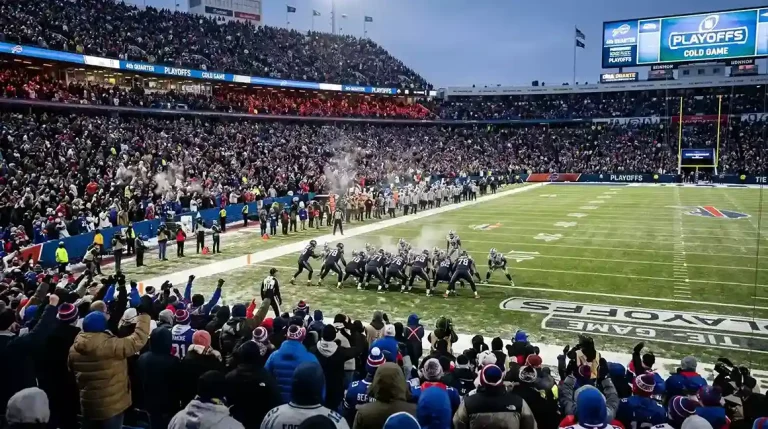 NFL playoff game atmosphere with packed stadium and intense defensive action near the end zone