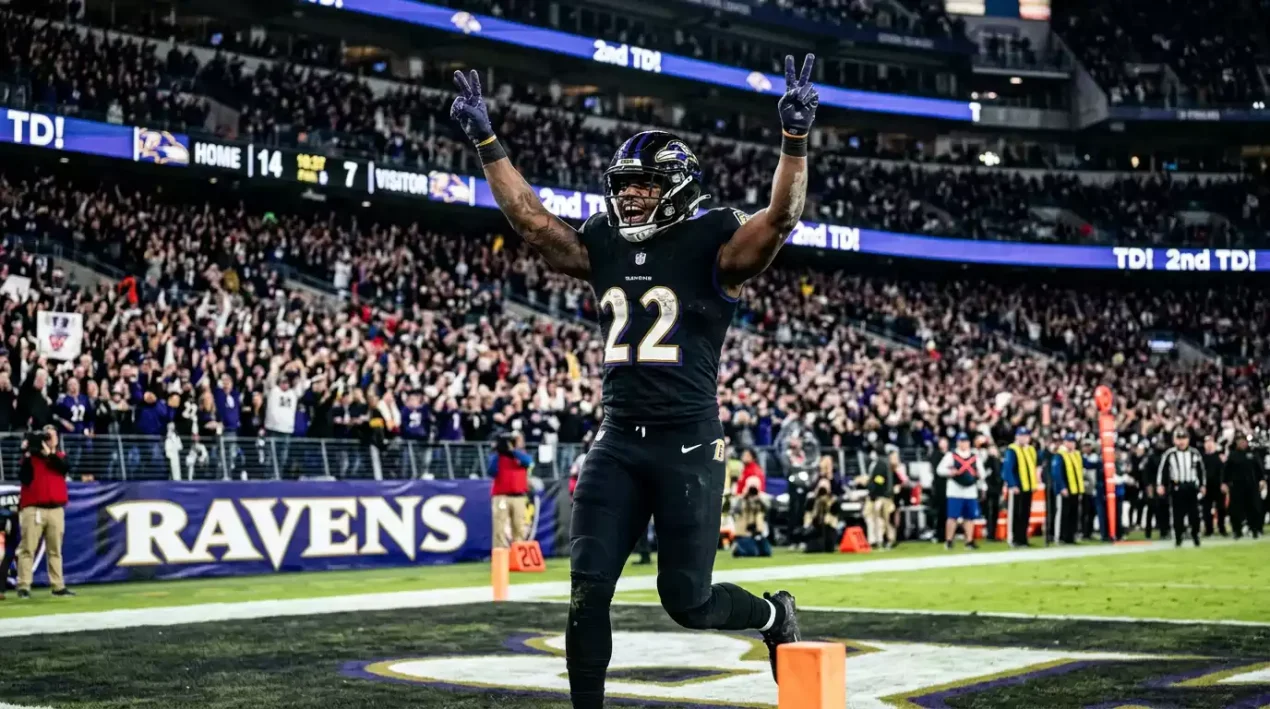 NFL player celebrating after scoring his second touchdown of the game